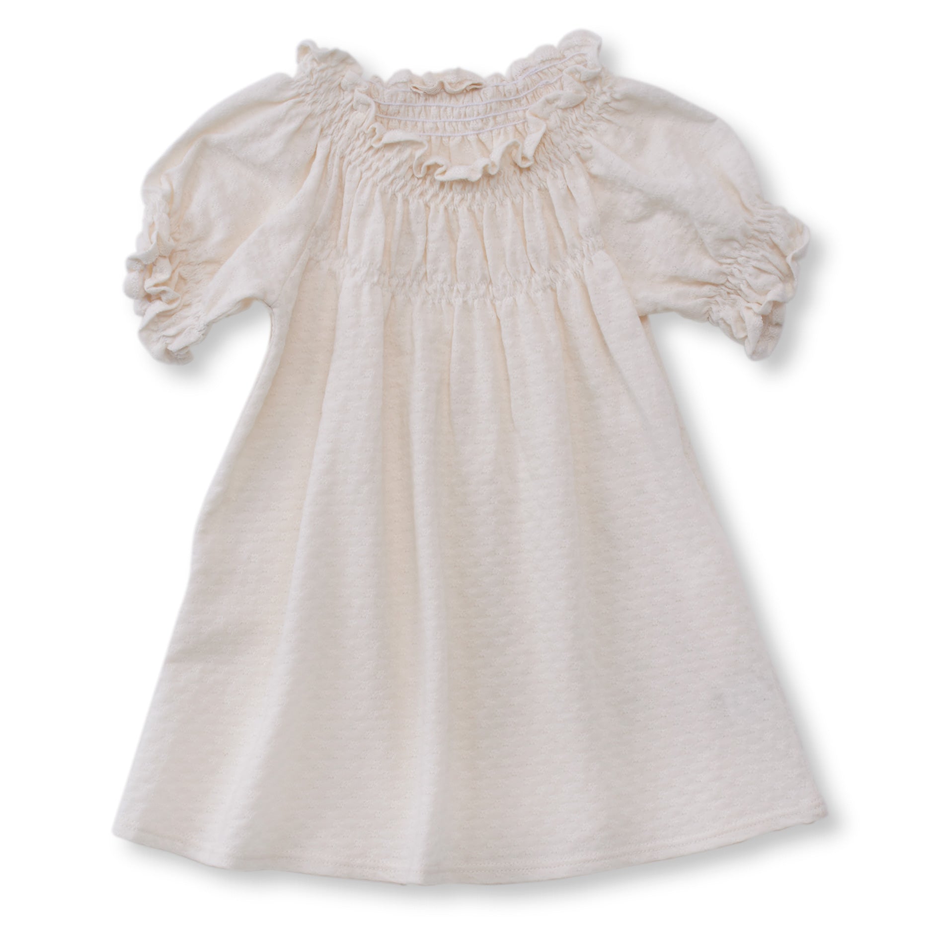 cream color pointelle short sleeved dress with soft elastic gathering at neckline and cuffs. 100% organic cotton pointelle knit.