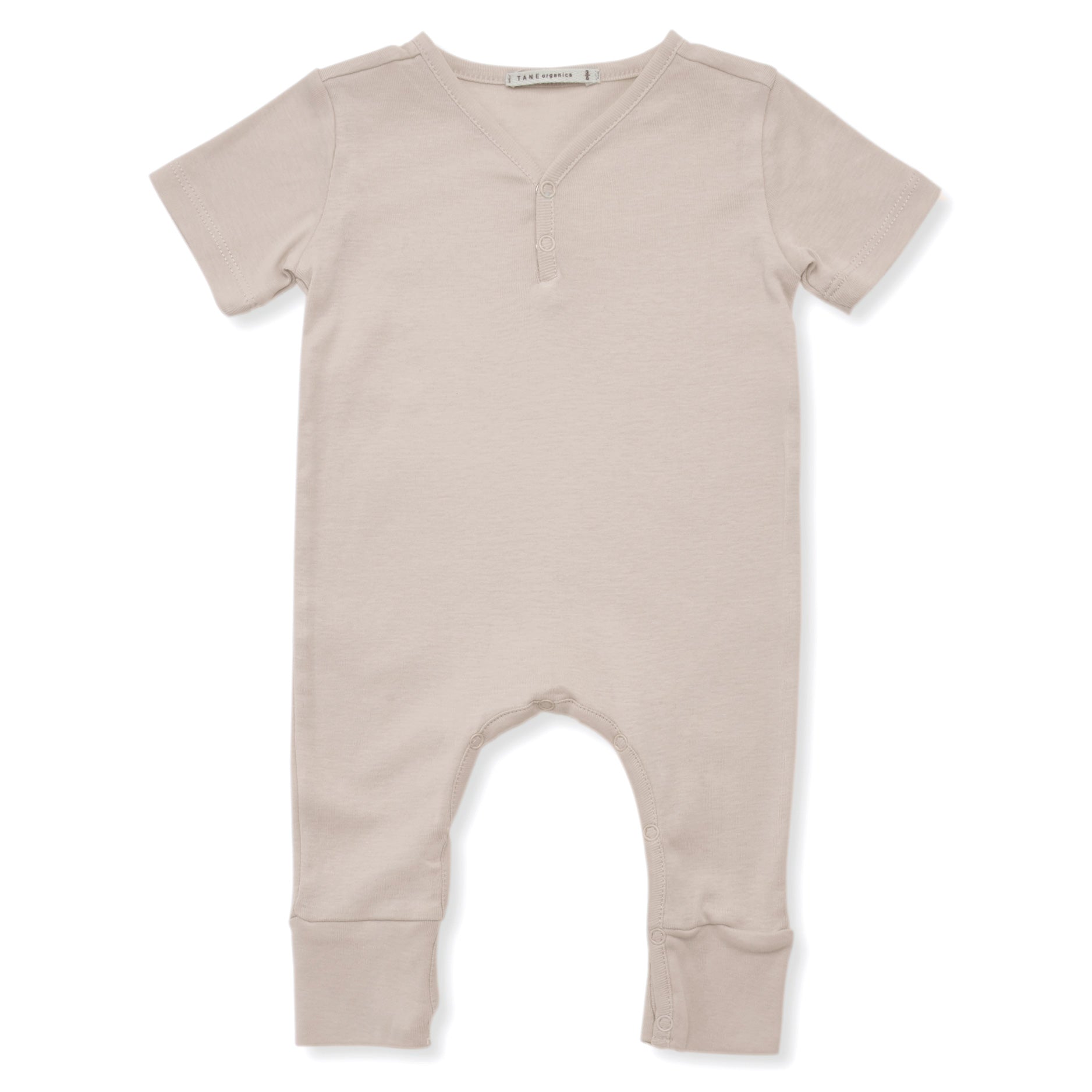 ivory color short sleeved v-neck coverall with 2 buttons and elongated legs. 100% organic pima cotton ribbed knit.
