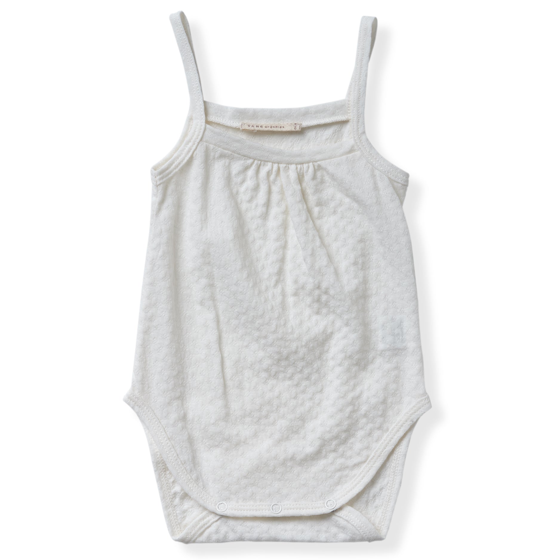 cream color pointelle tank onesie with gentle snaps. 100% organic cotton.