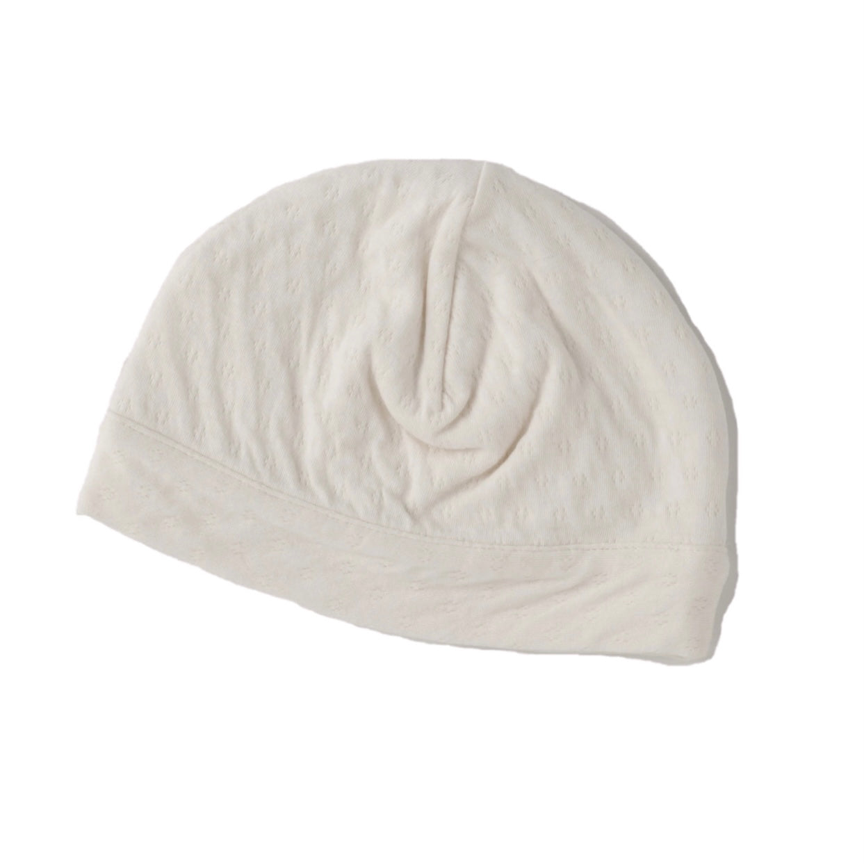cream color pointelle double layered skull cap for newborn.  100% organic cotton.